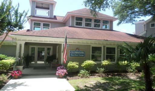View of front of home with french doors, roof with