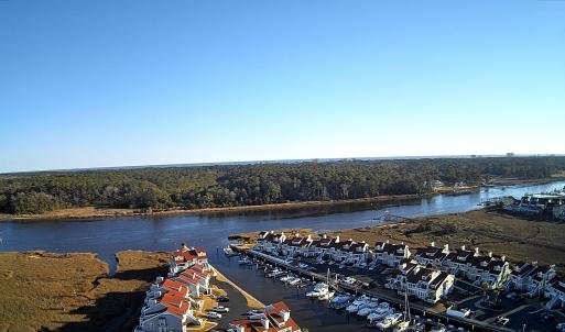 Water view featuring a heavily wooded area