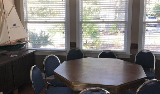 Dining area with wood finished floors, a ceiling f