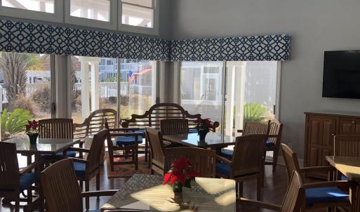 Dining space with a towering ceiling, plenty of na