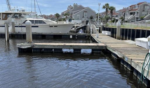 Dock area with a water view and a residential view