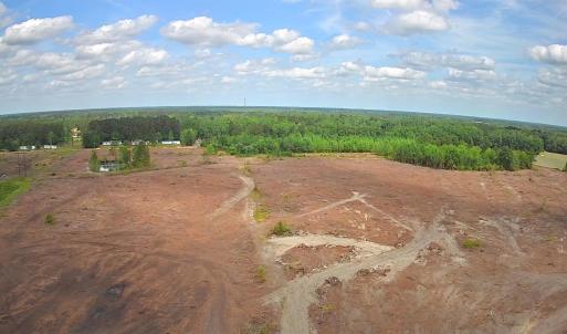 Aerial view of property and surrounding area with