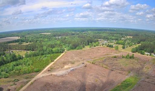 View of property location featuring a heavily wood