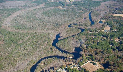 Aerial view of property and surrounding area with