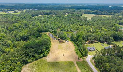 Aerial view of property and surrounding area with