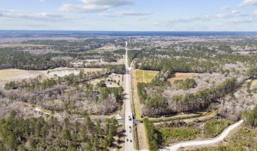 Aerial view of property and surrounding area with