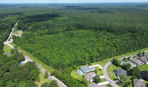 Aerial view of property and surrounding area with