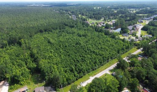View of property location featuring a heavily wood