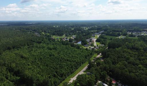 View of property location with a forest