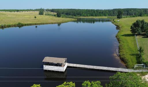 Aerial view of a nearby body of water and a heavil