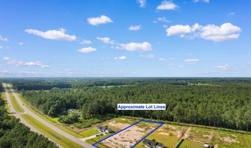Aerial view of property and surrounding area with