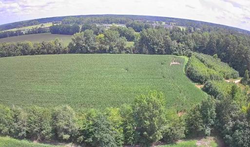 Aerial view of property and surrounding area with