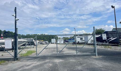View of green lawn featuring a water view