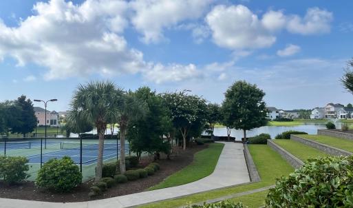View of property's community with a pool and a pat