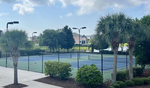 View of property's community with a tennis court,