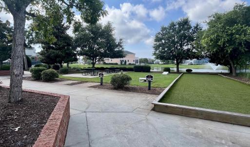 View of sport court featuring a tennis court