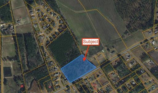 Aerial view of property's location with property p