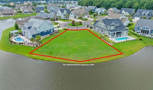 Aerial view of residential area featuring a pool a