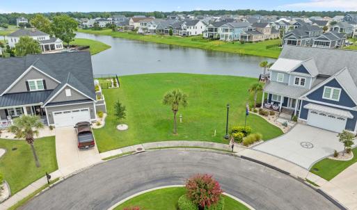 Aerial view of residential area with a large body