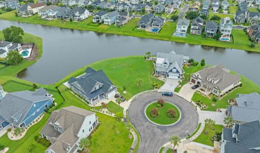 Aerial view of residential area with a nearby body
