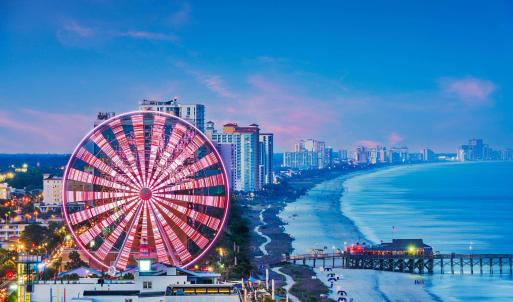Water view featuring city skyline and nearby beach