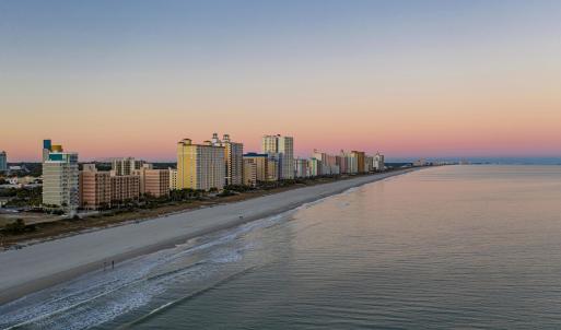 Drone / aerial view of city skyline and unending s
