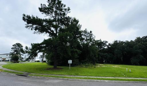 View of asphalt road with sidewalks and curbs