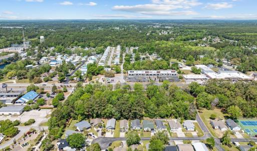 Aerial view of property and surrounding area with