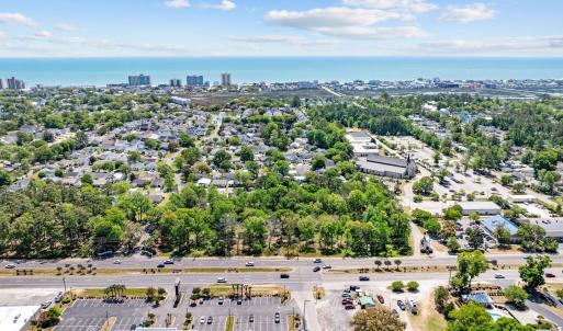 Aerial view of a tree filled landscape and a large
