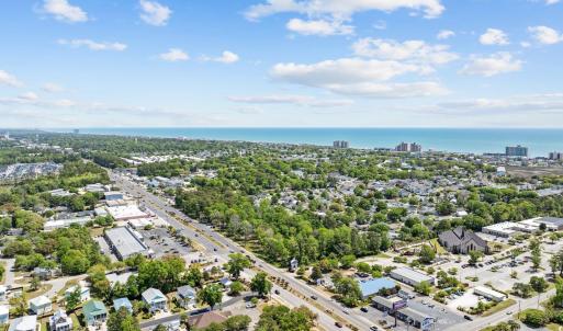 View of urban area with a tree filled landscape an