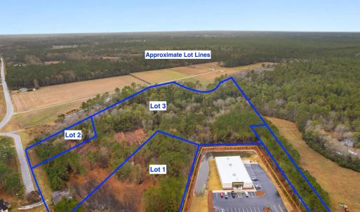 View of property location with a forest and proper