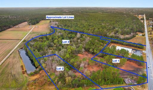 View of rural area with a forest and property parc