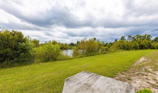 View of grassy yard featuring a water view