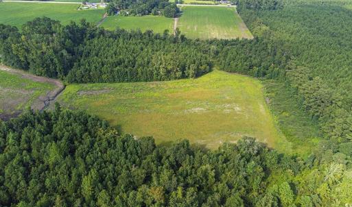 Aerial view of property and surrounding area with