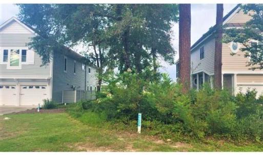 View of property exterior featuring a garage