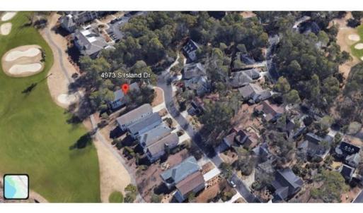 Aerial view of property's location featuring a gol