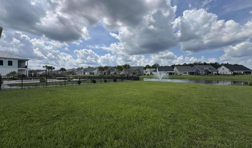 View of grassy yard featuring a residential view a