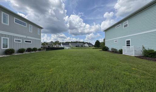 View of grassy yard featuring a residential view
