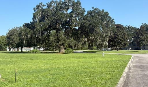 View of property's community with a yard and view