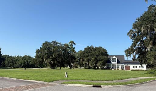 View of property's community with a yard