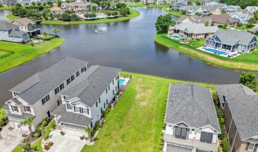 Aerial view of residential area with a nearby body