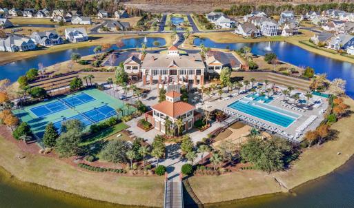 Aerial view of a nearby body of water and a pool a