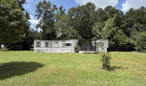 Manufactured / mobile home featuring a wooden deck