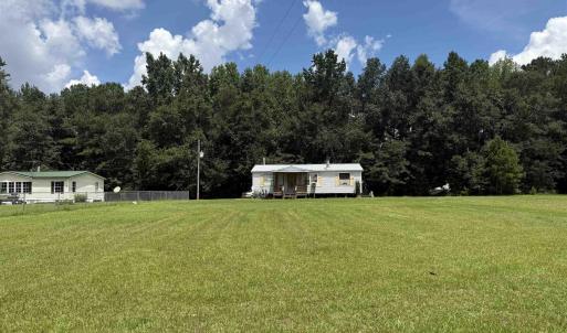 View of yard featuring a wooded view