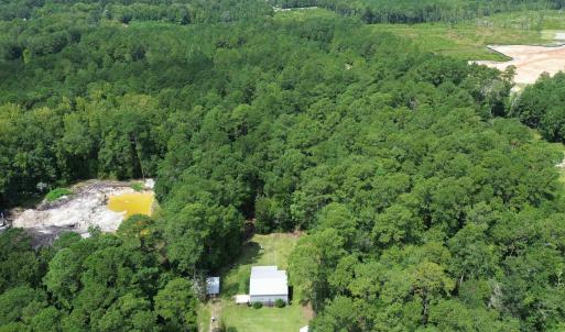 Aerial view of property and surrounding area with