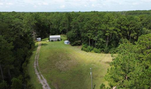 View of subject property featuring a forest