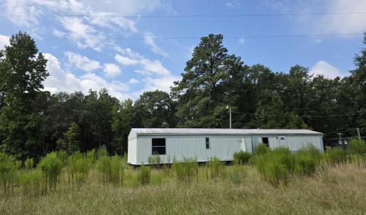 View of yard with a wooded view
