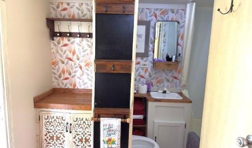 Bathroom featuring vanity and crown molding