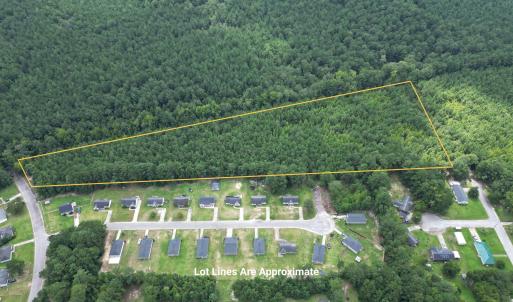 Aerial view of property and surrounding area with