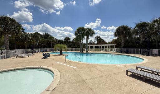 Community pool featuring a patio area